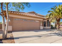 Attractive single-story home with a two-car garage and desert landscaping at 18466 N 5Th Ave, Phoenix, AZ 85023