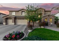 Two-story house with stone accents and a landscaped front yard at 4142 E Ravenswood Dr, Gilbert, AZ 85298