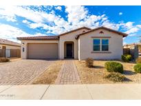 Single-story home with attached garage and landscaped front yard at 4806 S 110Th Ave, Tolleson, AZ 85353