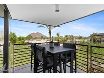 Spacious balcony with mountain views and seating for four at 7117 E Rancho Vista Dr # 4005, Scottsdale, AZ 85251