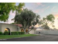 Charming ranch home with mature landscaping and a two-car garage at 7301 E Claremont St, Scottsdale, AZ 85250