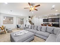 Open living room with large sectional sofa, creating a spacious and comfortable atmosphere at 1705 S 82Nd Pl, Mesa, AZ 85209