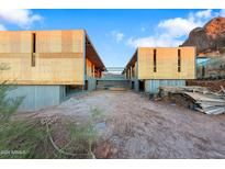 Modern home under construction with two-toned exterior and mountain views at 4975 E Mcdonald Dr, Paradise Valley, AZ 85253