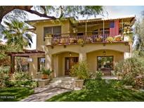 Charming two-story home with a large front porch and well-manicured lawn at 522 W Roosevelt St, Phoenix, AZ 85003