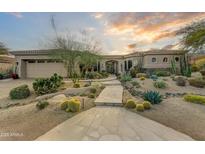 Stunning desert landscape surrounds this single-story home with a large three-car garage at 9697 E Preserve Way, Scottsdale, AZ 85262