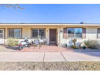 Inviting condo exterior featuring a patio and landscaping at 13609 N Newcastle Dr, Sun City, AZ 85351