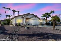 One-story home with desert landscaping and a two-car garage at 1658 S Oak St, Gilbert, AZ 85233