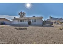 Remodeled single story home with a landscaped front yard at 1801 E Paradise Ln, Phoenix, AZ 85022