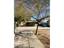 Ranch style home with large driveway and mature trees at 2029 N 22Nd Pl, Phoenix, AZ 85006