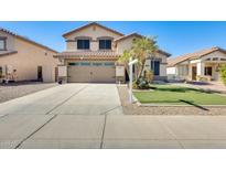 Two-story house with a two-car garage and landscaped front yard at 3610 N 106Th Ave, Avondale, AZ 85392