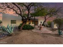 Desert landscaping with fountain, patio, and charming Southwestern style home at 4314 E Forest Pleasant Pl, Cave Creek, AZ 85331