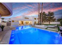 Stunning modern home featuring a luminous pool, spa, and an expansive outdoor living space at 9809 E Desert Cove Ave, Scottsdale, AZ 85260