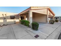 Neat stucco home with carport and well-manicured landscaping at 12017 N 27Th Pl, Phoenix, AZ 85028