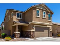 Two-story house with tan siding, stone accents, and a two-car garage at 1333 N Balboa --, Mesa, AZ 85205