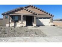 One-story home with a two-car garage and desert landscaping at 19026 W Stella Ave, Waddell, AZ 85355