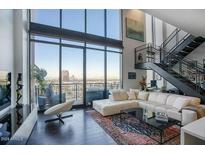 Spacious living room with floor to ceiling windows and city views at 200 W Portland St # 1312, Phoenix, AZ 85003