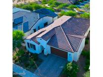 Aerial view of a house, showcasing its tile roof and landscaping at 20363 W Coolidge St, Buckeye, AZ 85396