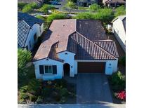 Beautiful single-Gathering home with a tile roof, manicured landscaping, and a two-car garage at 20363 W Coolidge St, Buckeye, AZ 85396