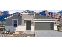 Single-story home with gray exterior, two-car garage, and desert landscaping at 2324 W Moody Trl, Phoenix, AZ 85041