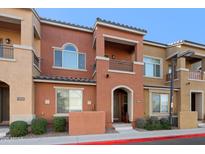 Attractive two-story townhome with a charming facade and well-manicured landscaping at 240 W Juniper Ave # 1173, Gilbert, AZ 85233