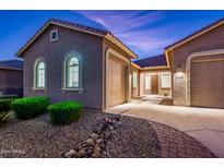 Two-car garage, well-lit entrance and nicely landscaped front yard at 24018 N 165Th Dr, Surprise, AZ 85387