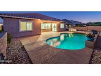 Stunning pool and patio area at dusk at 24018 N 165Th Dr, Surprise, AZ 85387