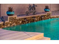 Relaxing pool with water features and statuary at 24018 N 165Th Dr, Surprise, AZ 85387