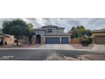 Two-story home with a two-car garage and landscaped front yard at 2463 W Morning Sun Cir, San Tan Valley, AZ 85144