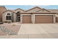 Single-story home with a two-car garage and desert landscaping at 26616 N 42Nd Way, Cave Creek, AZ 85331