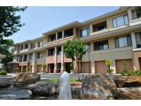 Attractive exterior of a two-story building with attached garages and landscaping at 2989 N 44Th St # 2001, Phoenix, AZ 85018