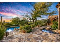 Stunning backyard with a pool, spa, and mountain views at 39863 N 105Th Pl, Scottsdale, AZ 85262