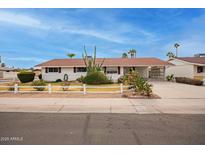 Ranch style home with carport and landscaped front yard at 501 W Linda Ln, Chandler, AZ 85225