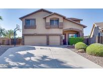 Two-story house with a three-car garage and a basketball hoop at 9022 W Ross Ave, Peoria, AZ 85382