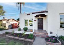 Charming Spanish style home with landscaped front yard at 903 W Mackenzie Dr, Phoenix, AZ 85013