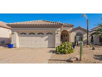 Single-story home with two-car garage and desert landscaping at 10173 E Conieson Rd, Scottsdale, AZ 85260