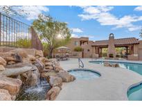Resort-style pool, spa, and outdoor kitchen area at 13600 N Fountain Hills Blvd # 604, Fountain Hills, AZ 85268