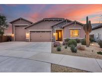 Beautiful desert home with 3-car garage and landscaped front yard at 24280 N 164Th Dr, Surprise, AZ 85387