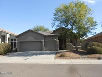 Single-story home with a two-car garage and landscaped front yard at 26811 N 41St Ct, Cave Creek, AZ 85331