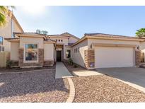 Single-story home with stone accents and a two-car garage at 3143 E Morenci Rd, San Tan Valley, AZ 85143