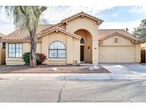 Cute single-story home with a terracotta roof and desert landscaping at 3531 N 108Th Ave, Avondale, AZ 85392