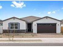 Charming single-story home featuring a two-car garage and desert landscaping at 17691 W Southgate Ave, Goodyear, AZ 85338