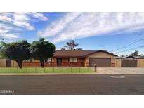 Ranch style home with attached garage and fenced yard at 2270 S Apache Dr, Apache Junction, AZ 85120