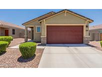 One-story house with a red garage door and well-manicured landscaping at 3751 E Archer Dr, San Tan Valley, AZ 85140