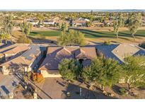 Aerial view of single-story home with solar panels, near golf course at 3755 N 161St Ave, Goodyear, AZ 85395