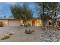 Desert landscape with charming one-story home, featuring a two-car garage at 3755 N 161St Ave, Goodyear, AZ 85395