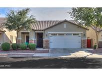 Single-story home with a two-car garage and landscaped front yard at 4129 E Cathy Dr, Gilbert, AZ 85296