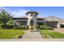 Beautiful home with circular driveway and lush landscaping at 8400 E Columbus Ave, Scottsdale, AZ 85251