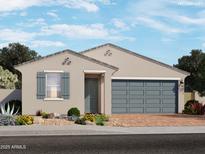 One-story home with gray garage door and landscaping at 8656 W Warner St, Tolleson, AZ 85353