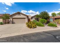 Single-story home with desert landscaping and two-car garage at 10902 E Silver Mine Rd, Gold Canyon, AZ 85118