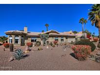 Single-story home with desert landscaping and a two-car garage at 16060 N Boulder Dr, Fountain Hills, AZ 85268